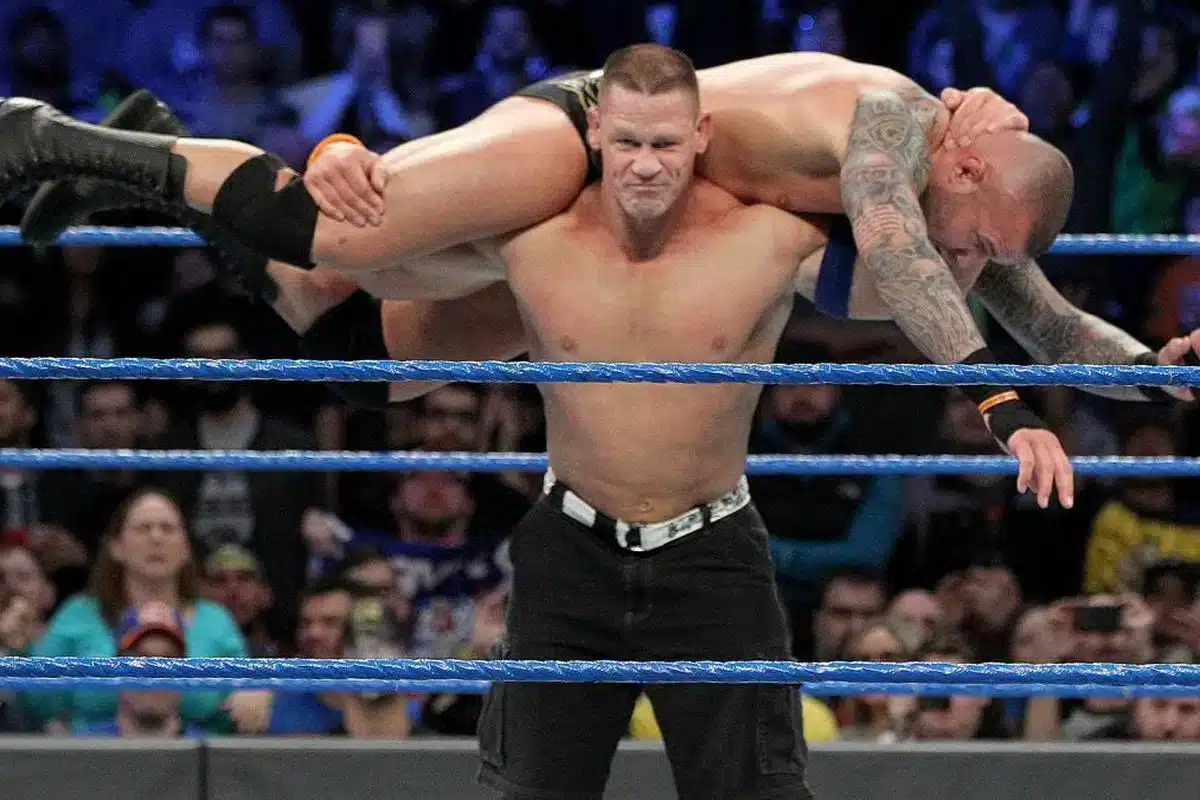 John Cena performing Attitude Adjustment on Randy Orton