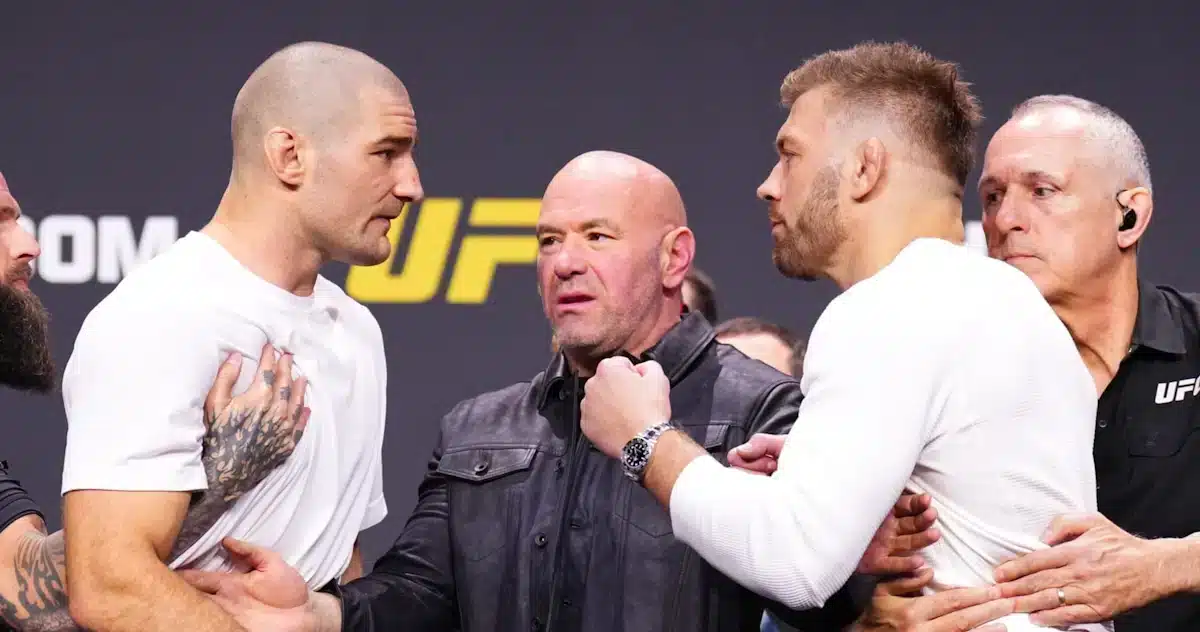 Dricus du Plessis (on the right) and Sean Strickland (on the left) appear at the UFC 297 weigh in at Scotiabank Centre in Toronto in front of UFC President Dana White 