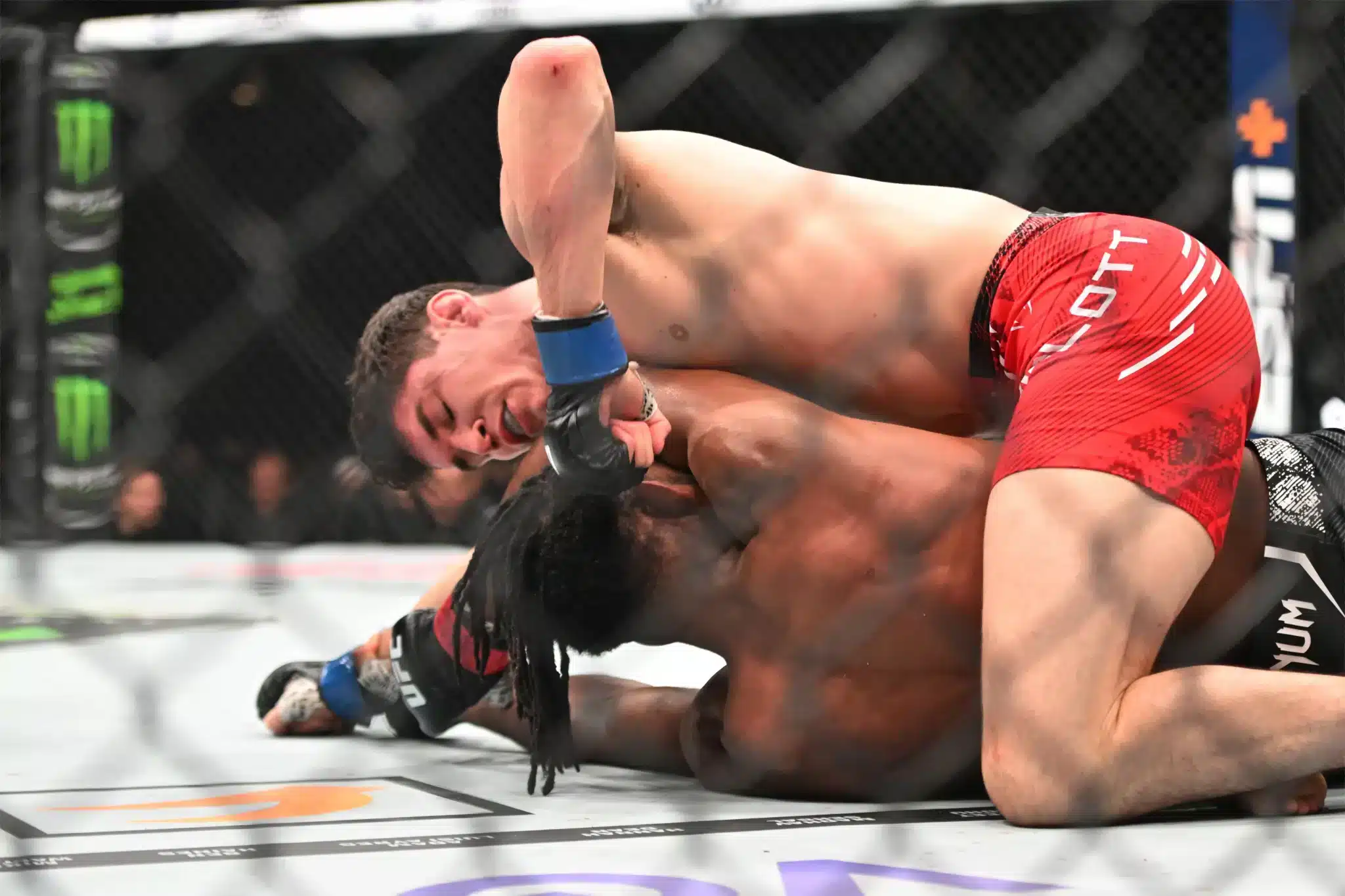 Neil Magny (bottom) comes back to beat Canadian Mike Malott at UFC 297 in Toronto.