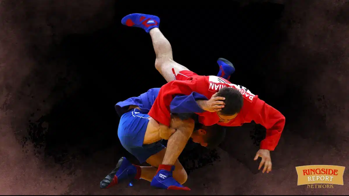 Two Men Practising Sambo, The Russian Combat Art On A Wrestling Mat