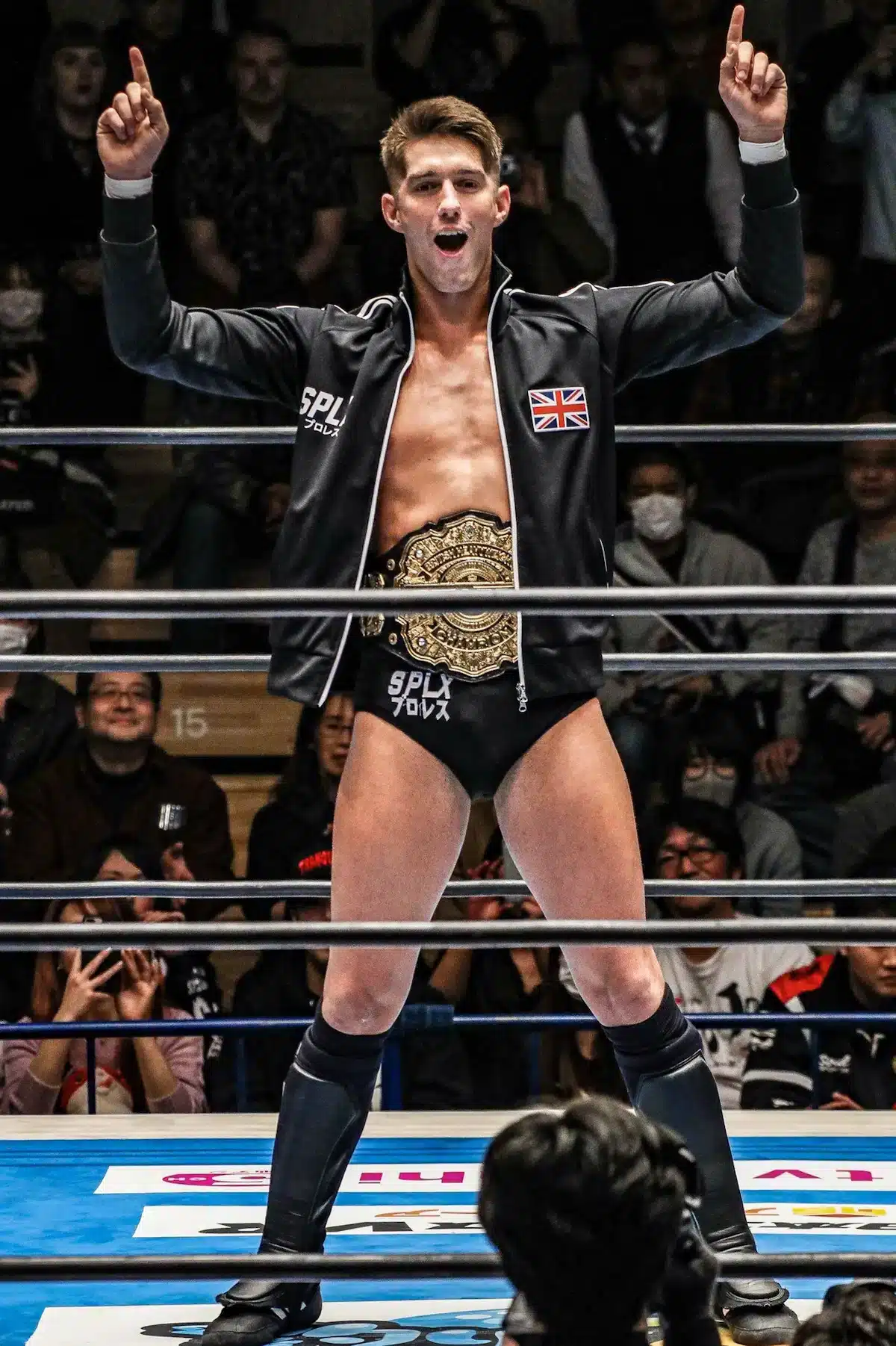 Photo Of Zack Sabre Jr. In The Centre Of A Wrestling Ring Indicating With His Fingers That He'S Number 1