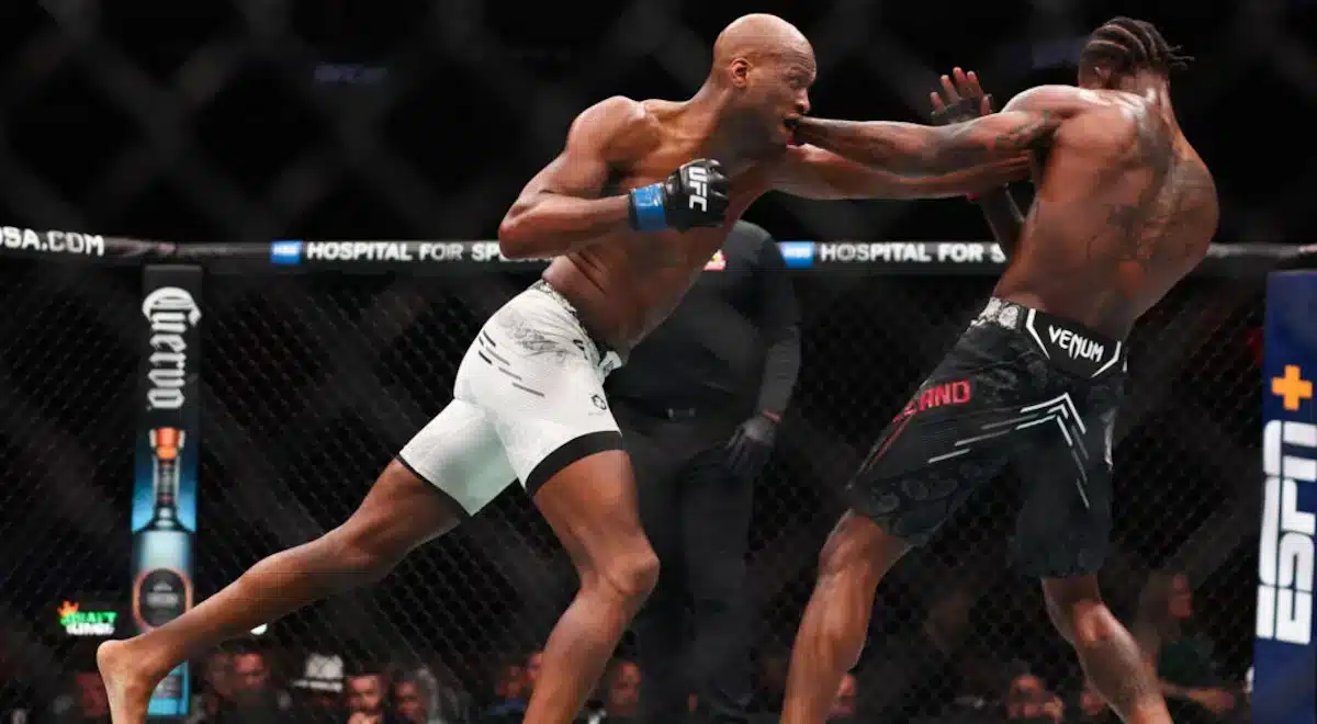 MVP attacking Kevin Holland in the octagon on the way to victory at UFC 299