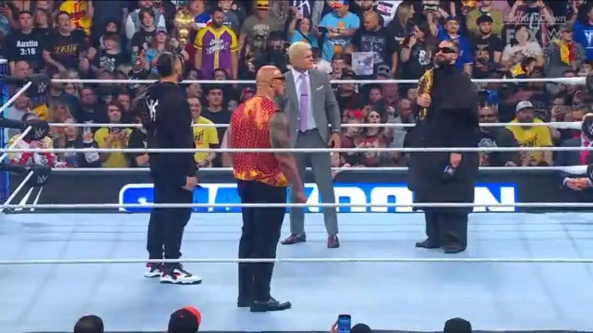 Roman Reigns, The Rock, Cody Rhodes and Seth Rollins (L to R) in the ring at WWE Smackdown talking to each other