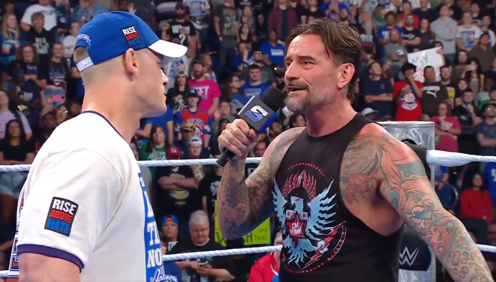 From CM Punk's Sellout to Goldberg's Return: Unpacking WWE and AEW's Biggest Stories 1 Cm Punk Addressing John Cena In The Smackdown Ring June 13 2025