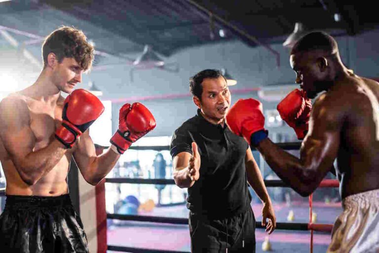 Boxing Basics: Two Young Professional Boxer Having A Competition Tournament On Stage. Attractive Male Athlete Fighters Muscular Shirtless Punches And Hitting Competitor Enjoy Boxing Exercise In The Ring At Stadium.