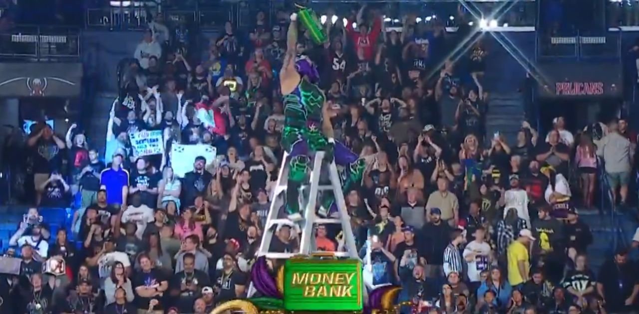 Penta Wwe Money In The Bank 2026 Mens Champ Celebrating Atop A Ladder.